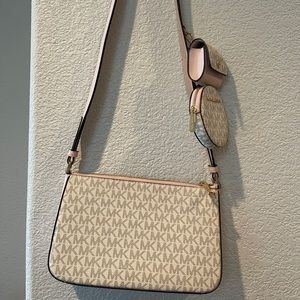 MK. crossbody Tech Attached MK Vanilla with air pod case, coin wallet case.